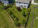 Well-maintained backyard with lush green grass, mature trees, privacy fence, and a patio area at 4863 Sherlock Dr, Westfield, IN 46062