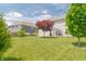 Expansive backyard featuring lush green lawn and mature trees, offering ample space for outdoor activities and landscaping at 4863 Sherlock Dr, Westfield, IN 46062