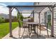 Backyard patio featuring a pergola, grill, and outdoor dining set, providing an ideal space for relaxation and entertaining at 4863 Sherlock Dr, Westfield, IN 46062
