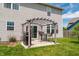 Backyard patio area with pergola, barbecue grill, and table set, great for outdoor dining and entertaining at 4863 Sherlock Dr, Westfield, IN 46062