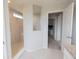 Bathroom featuring tiled walk-in shower with glass enclosure and tiled floors at 4863 Sherlock Dr, Westfield, IN 46062