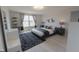 Well-lit bedroom featuring a platform bed with a decorative rug and modern decor at 4863 Sherlock Dr, Westfield, IN 46062