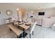 Spacious dining area leading into a cozy living room with a fireplace and ample natural light at 4863 Sherlock Dr, Westfield, IN 46062