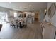 Open dining area with a stylish table, seating for six, and easy access to the kitchen and backyard at 4863 Sherlock Dr, Westfield, IN 46062