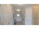Inviting foyer with decorative wall paneling, elegant lighting, a console table and access to other rooms at 4863 Sherlock Dr, Westfield, IN 46062
