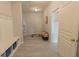 Inviting entryway with a hall tree, bench, and durable hardwood floors at 4863 Sherlock Dr, Westfield, IN 46062