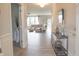 Hallway view to a bright, inviting living area, showcasing the home's open layout and neutral color palette at 4863 Sherlock Dr, Westfield, IN 46062