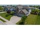 Two-story home with brick and siding exterior, attached two-car garage, manicured lawn and driveway at 4863 Sherlock Dr, Westfield, IN 46062