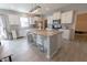 Modern kitchen featuring a large island with seating, stainless steel appliances, and ample cabinet space at 4863 Sherlock Dr, Westfield, IN 46062
