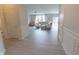 Bright entryway leading into a naturally lit living room with contemporary furniture and a sliding glass door at 4863 Sherlock Dr, Westfield, IN 46062