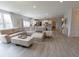 Spacious living room with large sectional sofa, hardwood floors, and lots of natural light at 4863 Sherlock Dr, Westfield, IN 46062