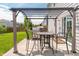 Outdoor patio area with a pergola, dining table, and grill, perfect for outdoor entertaining at 4863 Sherlock Dr, Westfield, IN 46062