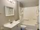 Cozy bathroom with a tub, shower and a clean white vanity sink at 4943 S State Ave, Indianapolis, IN 46227