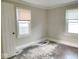 Bedroom with new flooring and two windows at 4943 S State Ave, Indianapolis, IN 46227