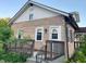 Charming home boasts a stone facade, stylish front door, and a cozy porch with decorative railing at 4943 S State Ave, Indianapolis, IN 46227