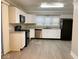 Spacious kitchen featuring white cabinets, stainless steel appliances, and ample counter space at 4943 S State Ave, Indianapolis, IN 46227