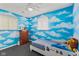 Whimsical bedroom featuring colorful blue walls with cloud accents and a cozy bed at 5115 Bertha St, Indianapolis, IN 46241