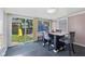 Dining room offers a stunning view of the backyard play area, creating a delightful dining atmosphere at 5115 Bertha St, Indianapolis, IN 46241