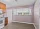 The kitchen showcases modern appliances, ample cabinetry, and seamlessly connects to an adjacent living space at 5115 Bertha St, Indianapolis, IN 46241