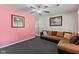 Open-concept living room featuring a sectional sofa, and neutral-toned walls at 5115 Bertha St, Indianapolis, IN 46241