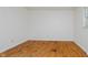 Spacious bedroom with hardwood floors and a window providing natural light at 530 Westmore Dr, Indianapolis, IN 46214