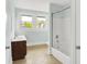 Bright bathroom featuring single sink with a wood cabinet and a shower over tub at 538 N East St, Greenfield, IN 46140
