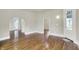 Open living area with wood floors, arched doorways, and a view of the entryway at 538 N East St, Greenfield, IN 46140