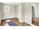 Mud room featuring wood-look flooring and access to backyard and kitchen at 538 N East St, Greenfield, IN 46140