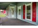 Covered porch featuring classic design elements and red shutters for added charm and curb appeal at 538 N East St, Greenfield, IN 46140