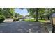 A spacious backyard boasts a basketball court and a quaint shed, perfect for outdoor activities at 5433 Brendonridge Rd, Indianapolis, IN 46226