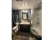 Basement bathroom with a toilet, vanity, mirror, and shower at 5433 Brendonridge Rd, Indianapolis, IN 46226