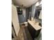 Nicely decorated basement bathroom with toilet, sink, mirror, and decor at 5433 Brendonridge Rd, Indianapolis, IN 46226