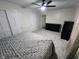 Spacious carpeted bedroom with ceiling fan, two dressers, and neutral walls at 5433 Brendonridge Rd, Indianapolis, IN 46226