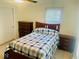 Bright carpeted bedroom with neutral walls, two dressers, and lots of natural light at 5433 Brendonridge Rd, Indianapolis, IN 46226