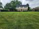 Beautiful two-story home with a brick and siding exterior and expansive green lawn at 5433 Brendonridge Rd, Indianapolis, IN 46226