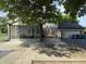 View of the exterior of the house including a screened in porch and a two car garage at 5433 Brendonridge Rd, Indianapolis, IN 46226