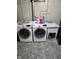 Finished basement laundry area with washer, dryer, and utility sink at 5433 Brendonridge Rd, Indianapolis, IN 46226