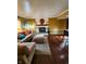 Open concept living area with fireplace, comfy seating, and eat-in kitchen area at 5433 Brendonridge Rd, Indianapolis, IN 46226