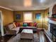 Comfortable living space with a fireplace, stylish decor, and a cozy sectional sofa at 5433 Brendonridge Rd, Indianapolis, IN 46226
