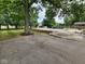 View of an in-ground swimming pool and large trees in the back yard at 5433 Brendonridge Rd, Indianapolis, IN 46226