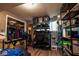 Organized basement featuring shelves, clothing rack, and storage bins, designed for practical storage at 5522 Closser Ct, Indianapolis, IN 46221