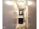Bathroom with single vanity, mirror, towel rack, and tile flooring at 5522 Closser Ct, Indianapolis, IN 46221
