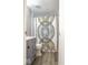 Bathroom featuring grey vanity, tile floor, and tub with a decorative shower curtain at 5522 Closser Ct, Indianapolis, IN 46221