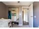 Neutral Bedroom featuring a white closet system and a doorway view, blending functionality with a calming aesthetic at 5522 Closser Ct, Indianapolis, IN 46221