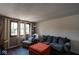 Comfortable living room features multiple windows, hardwood floors, and modern decor at 5522 Closser Ct, Indianapolis, IN 46221