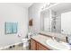 Functional bathroom featuring a sink, toilet, and shower, with a towel rack and storage cabinet at 5619 Payne Blvd, Plainfield, IN 46168