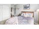 Cozy bedroom featuring a comfortable bed, neutral walls, and a closet for ample storage at 5619 Payne Blvd, Plainfield, IN 46168