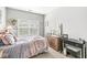 Bright bedroom with large window, neutral walls, and hardwood flooring at 5619 Payne Blvd, Plainfield, IN 46168
