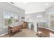 Bright dining area with a view from large window, neutral walls, and hardwood flooring at 5619 Payne Blvd, Plainfield, IN 46168