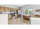 A bright kitchen features wooden cabinets, stainless steel appliances, and adjacent dining space at 5619 Payne Blvd, Plainfield, IN 46168